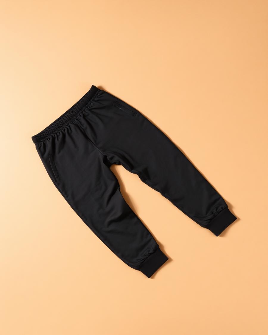 Commuter Tech Jogger — Four-way stretch, zip pockets, quiet finish.